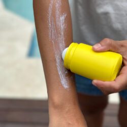 Solmates-Yellow-100ml-Refillable-Applicator-on-arm